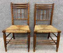 Two late 19th century William Morris Sussex chairs in the manner of Ford Maddox Brown for