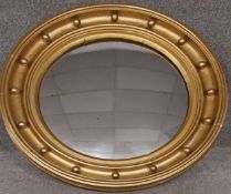 A 19th century gilt framed convex mirror. Dia.72cm D.8cm