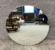 A contemporary circular wall hanging mirror. Dia.62cm.