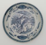 A Chinese blue and white bowl, Ming dynasty with bird and flower decoration. Dia.25cm