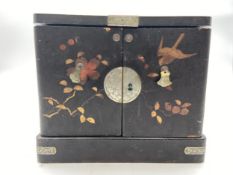 A Japanese lacquered and copper mounted dressing box with hand painted birds and foliage, having