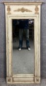 A painted and distressed French Empire style pier mirror, the frieze having a scrolling acanthus