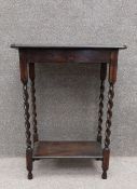 A mid century oak occasional table. H.73 W.56 D.41cm