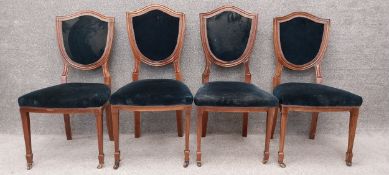 Four Edwardian mahogany shield back dining chairs. H.94cm (One in need of repair as shown).