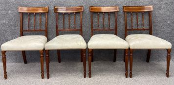 A set of four Edwardian style mahogany and satinwood inlaid dining chairs. H.88cm.