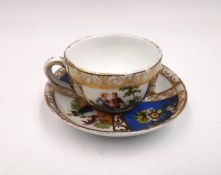 A Meissen August Rex miniature cup and saucer, with marks to the base. Dia.7cm