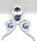 A pair of blue and white porcelain wall pockets with classical motifs, along with a blue and white