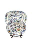 A 19th century Davenport 'Flying Bird' platter and tea plate with blue underglaze marks to the base.