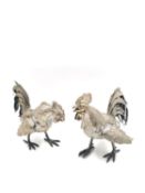A pair of French electroplated cast metal fighting cockerels with indistinct marks. H.20 L.25 W.