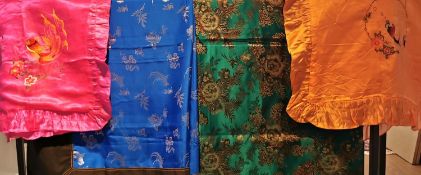 A collection of 19th century and later embroideries; Two embroidered satin tablecloths with