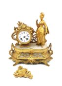 A French 19th century Rococo style gilt spelter and alabaster mantle clock with a noble lady
