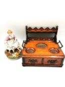 A 19th century oak deskstand with two drawers and a hand painted bisque figure group of a lady