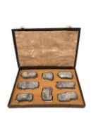 A Chinese calligraphy stone ink block set circa 1900, intricately carved in relief and hand