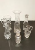 A collection of glass to include a tall flared etched vase with a floral design, three cut