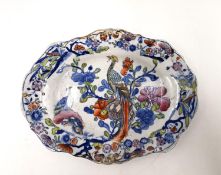 An early 19th century miniature Ironstone platter, with marks in underglaze blue to the base. L.17