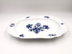 A 19th century blue and white Meissen platter with a central floral design with insects and sprigs