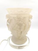 A neoclassical style opaque/frosted moulded lamp with putti/cherub relief decoration, in the style