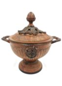 A neoclassical style cold-painted-spelter lidded urn with lion's head medallions to each side and