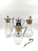 Four metal lidded wine/claret jugs; Three cut glass, and one ceramic; two with silver plated lids (