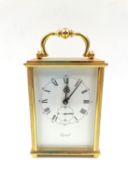 A Swiss made brass carriage clock by Imhof with 15 jewels. H.15cm incl of handle.