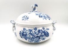 An early 19th century Meissen tureen with cover, painted with flowers and insects with a twisted