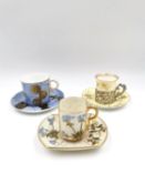 A collection of three 19th century and later Royal Worcester coffee cans with saucers, one with a