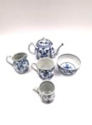 A collection blue and white porcelain miniatures to include a jug, a bowl, a teapot, and two cups.