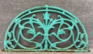 A cast iron Art Nouveau style fan window with a scrolling foliate design. H.60 W.111cm.