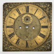 An 18th century engraved brass longcase clock face, the dial having Roman numerals and foliate
