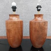 A pair of contemporary carved cherry baluster form table lamps. H.48cm.