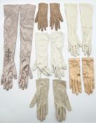 Six pairs of silk and other ladies evening gloves. Glove size small. L.55cm (largest).