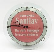 An early to mid 20th century table or wall mounted clock with a perspex surround, the face bearing