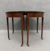 A Georgian mahogany D-end dining table with extra leaf. H.75 W.115 D.113cm extending to W.230cm (