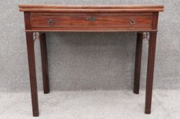 A Georgian mahogany tea table with foldover top and gateleg action. H.73.5 W.83 D.39cm