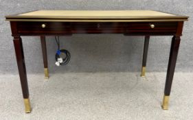 A contemporary 19th century style zebrawood writing desk with a leather inset top and moulded