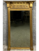 A Regency neoclassical giltwood pier mirror with a breakfront cornice above a key fret decorated