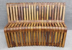 A mid-century Italian bent olivewood bench from a station waiting room in Bologna. H.85 W.150 D.74cm