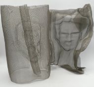 A pair of sculptural portraits impressed in wire mesh by Jocelyne Blair. H.46cm.