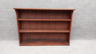 A 19th century walnut open bookcase. H.87 W.125.5 D.27cm