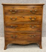 A Georgian mahogany bachelor's chest with a brushing slide above four graduating drawers, raised