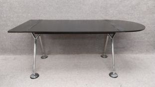 A 1980's d-end 'Nomos' desk in laminated plywood and chrome by Norman Foster for Tecno Spa. H.73 W.