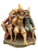 A 1930's ceramic clown figure group by Goldsheider, with an impressed maker's stamp to the back. H.