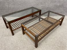 Two mid century walnut coffee tables with fitted glass tops and slatted under-tiers on square