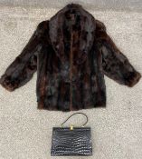 A mink fur coat with a rabbit colllar, and a crocodile skin handbag. Coat chest 44cm. Bag size H.