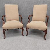 A pair of Georgian II style armchairs with crook shepherd carved walnut frame, upholstered in