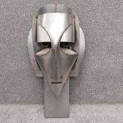 A large constructivist style sheet-metal sculpture titled 'Saintly Head', by Robert De Quin in the