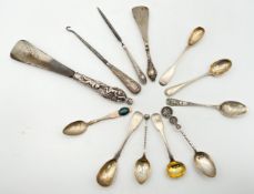 A collection of silver hallmarked items to include four spoons, a shoehorn, a letter opener, and a