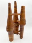 An abstract carved teak sculpture by Robert De Quin with an inscribed signature to the foot, dated