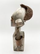 A copper and steel abstract bust, signed Robert De Quin and dated 1994. H.33cm.