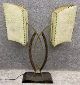 A mid-century ebonised wood and brass table lamp with gilt decoration and original hand stitched and